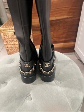 CHANEL Black Leather Over-the-Knee Boots with Gold Chain and CC Emblem